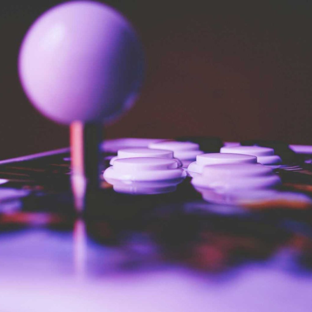 A vibrant close-up image of an arcade joystick and buttons, capturing a retro gaming mood.